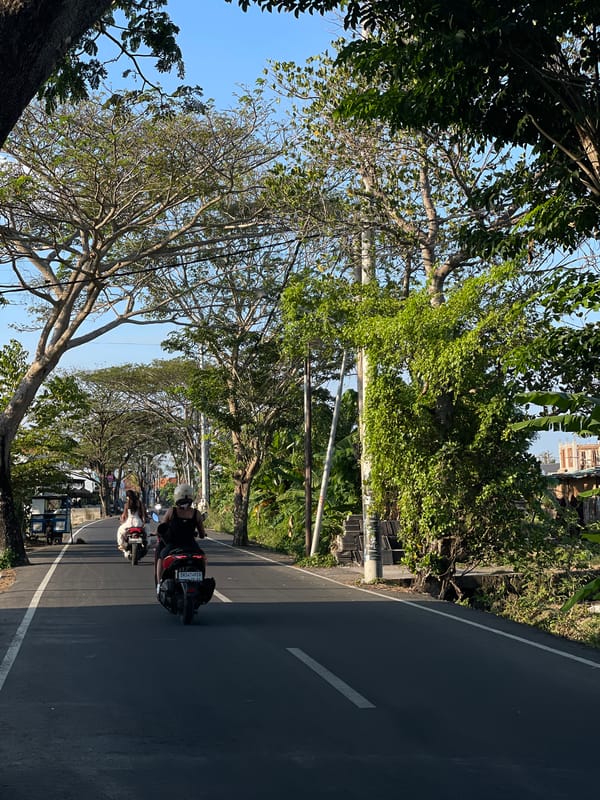 Quiet morning in Mengwi: roads, bikes, and a local cafe