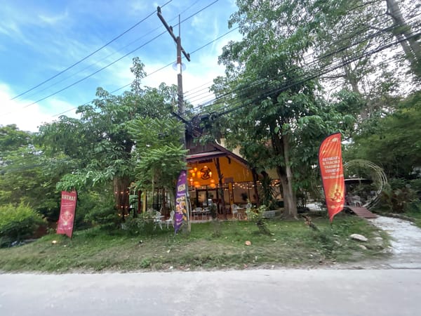 Daily life captured on tropical streets of Baan Sri Thanu