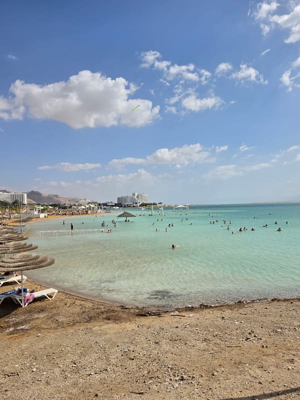 Visitors float in Dead Sea waters near Israeli shore