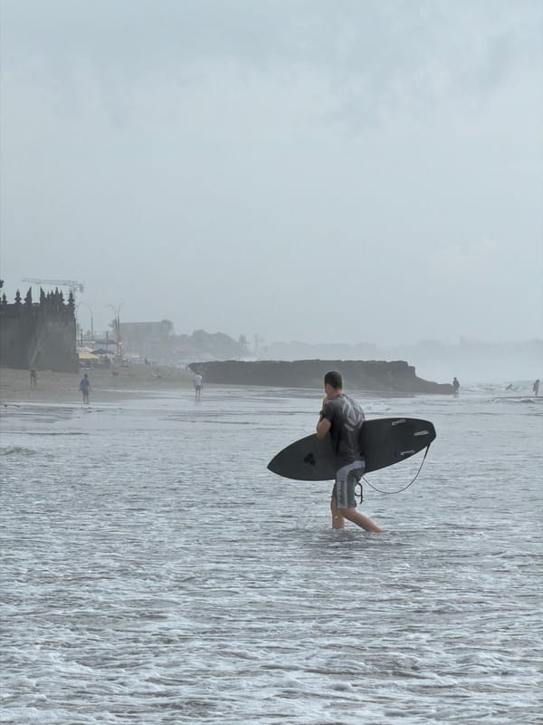 Early morning beach activity captured in North Kuta, Indonesia