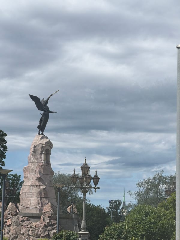 Winged scepter monument on pinkish stone base, Tallinn