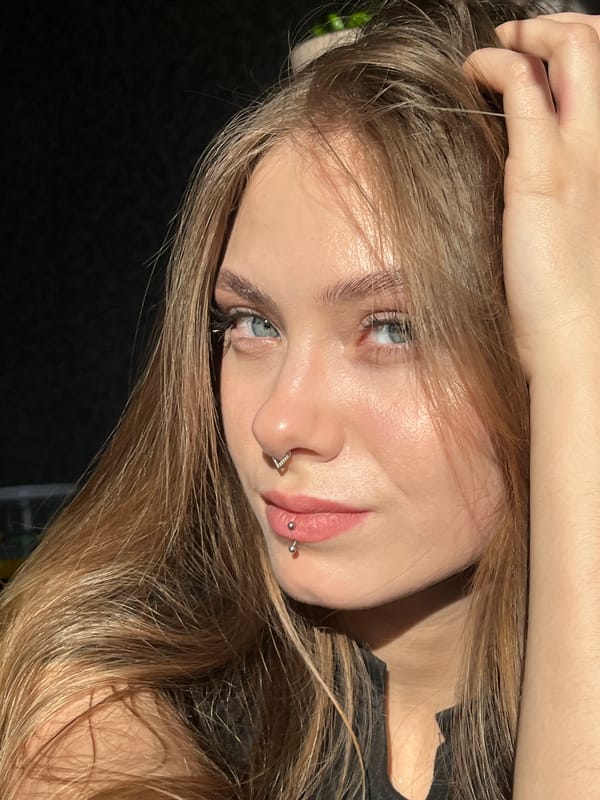 Young woman with piercings photographed in Russian village