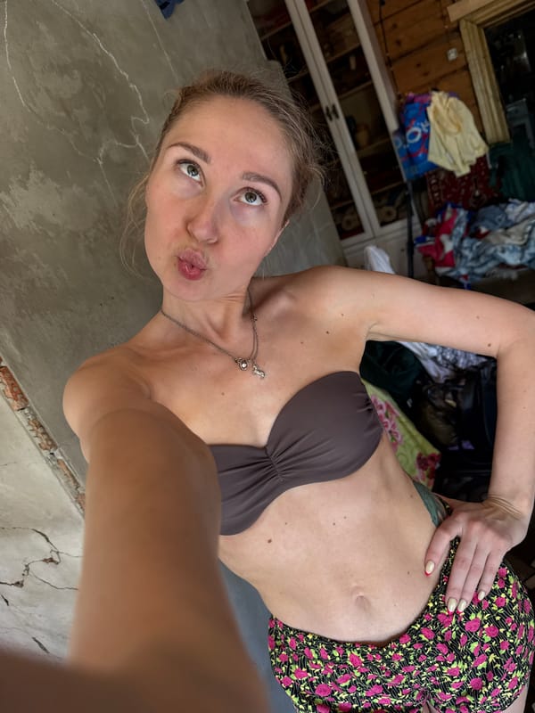 Woman takes selfies indoors in Nizhnyaya Chermoda, Russia