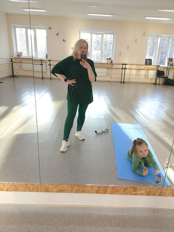 Mirror selfie and handmade doll captured in Izhevsk