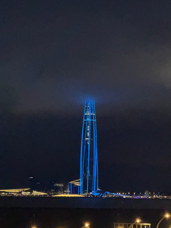 Lakhta Center glows blue over a stormy Saint Petersburg evening