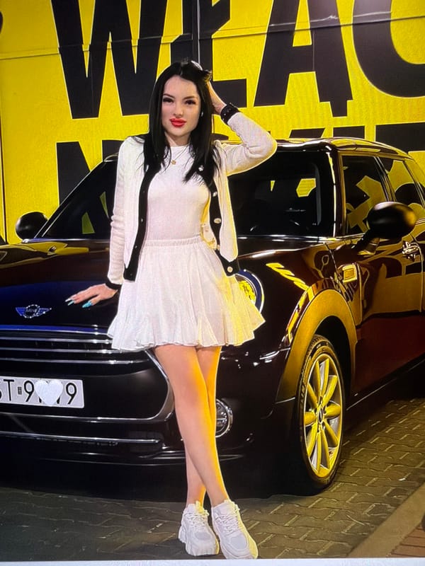 White outfit, lakeside platform, and a black cat in Strzelce Opolskie