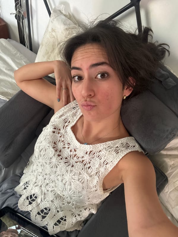 Woman rests on bed in Puebla, Mexico