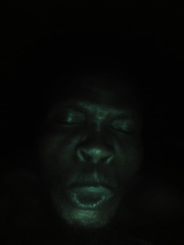 Multiple photos document man's varying expressions over evening hours