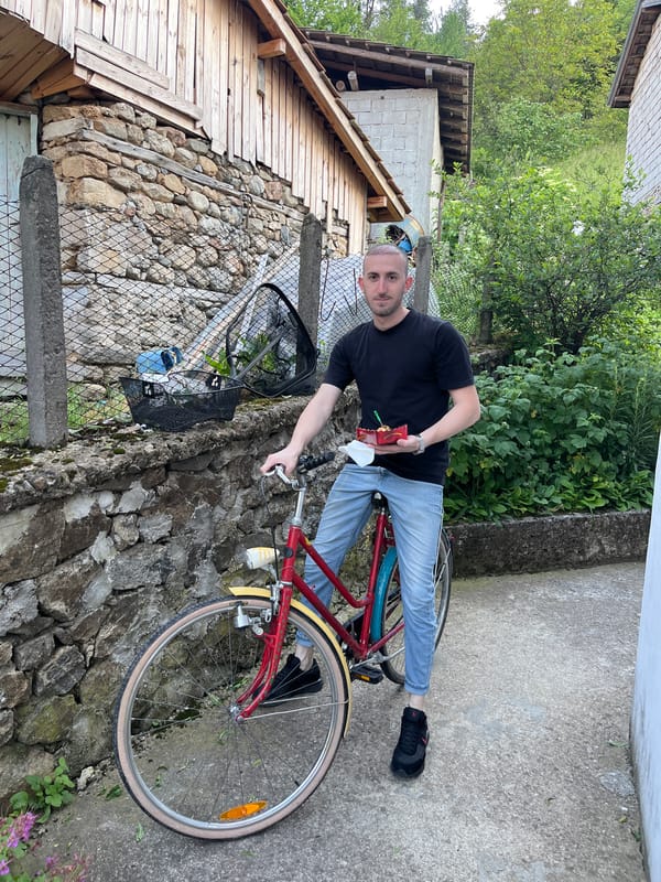 Man with bicycle spotted on path in Chepintsi, Bulgaria