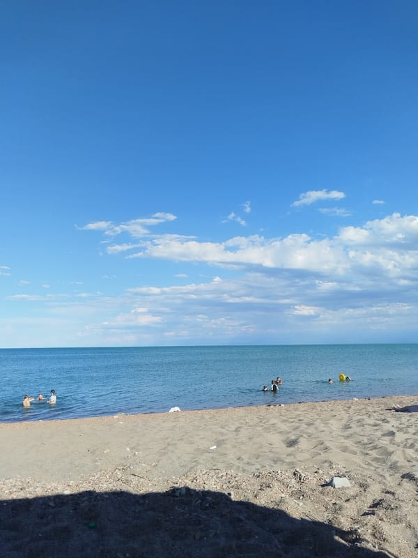 Calm beach day on the Kazakh shoreline near Qonaev