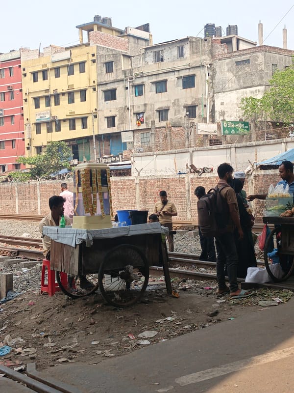 Morning street scene documented near Dhaka railway line