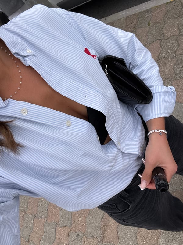 Two women take selfie on stone pavement in Vallauris