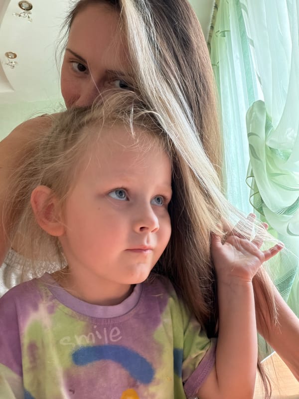 Woman documents morning moments with child in Kamyshin selfies