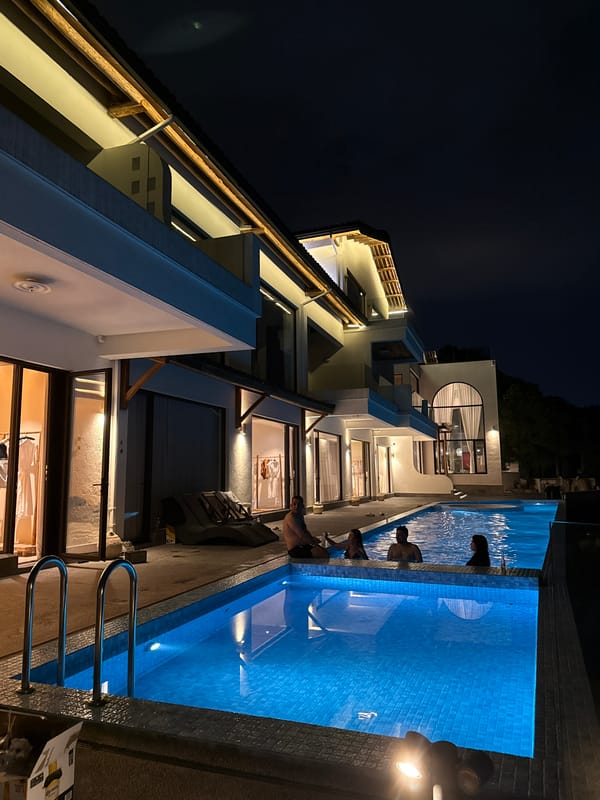 Nighttime gathering documented at Jinhua building complex with pool