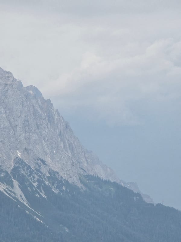 Garmisch-Partenkirchen rooftops and misty Alps on a cloudy afternoon