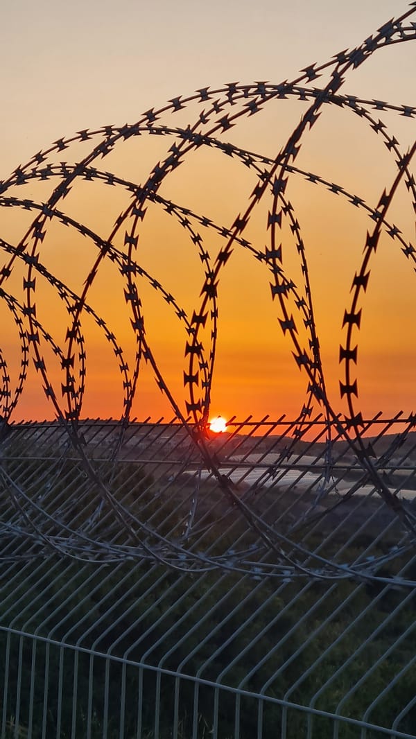 Sunset documented through barbed wire in Lachish Regional Council