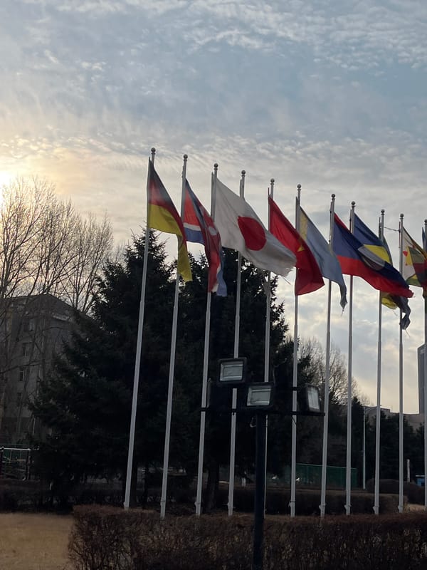 Changchun city scenes show flags, statue, architecture