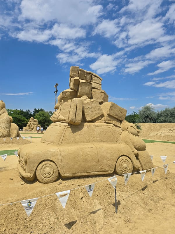 Sand sculpture exhibition in Burgas features vintage car with luggage