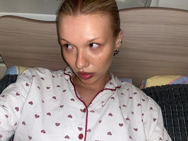 Elderly woman takes selfies around Chaikovsky apartment building