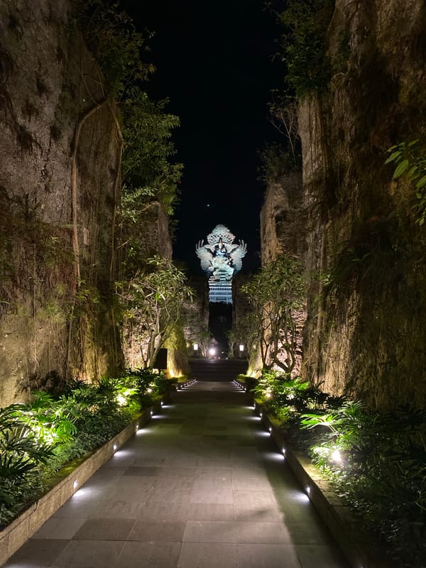 Nighttime tour through illuminated Hindu-Balinese sculpture garden
