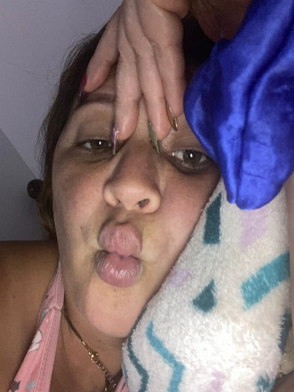 Playful close-up selfies under colorful blankets and towels