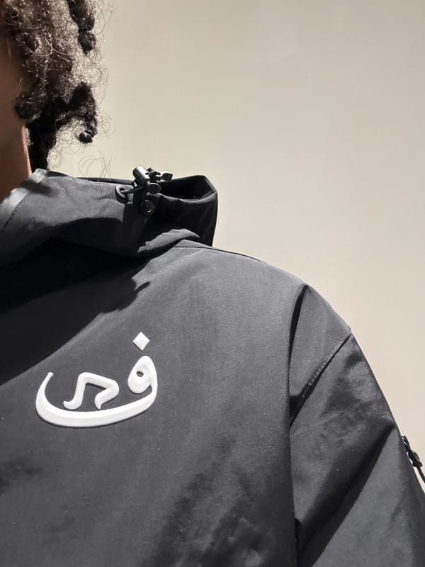 Person takes selfies in black jacket in Massy