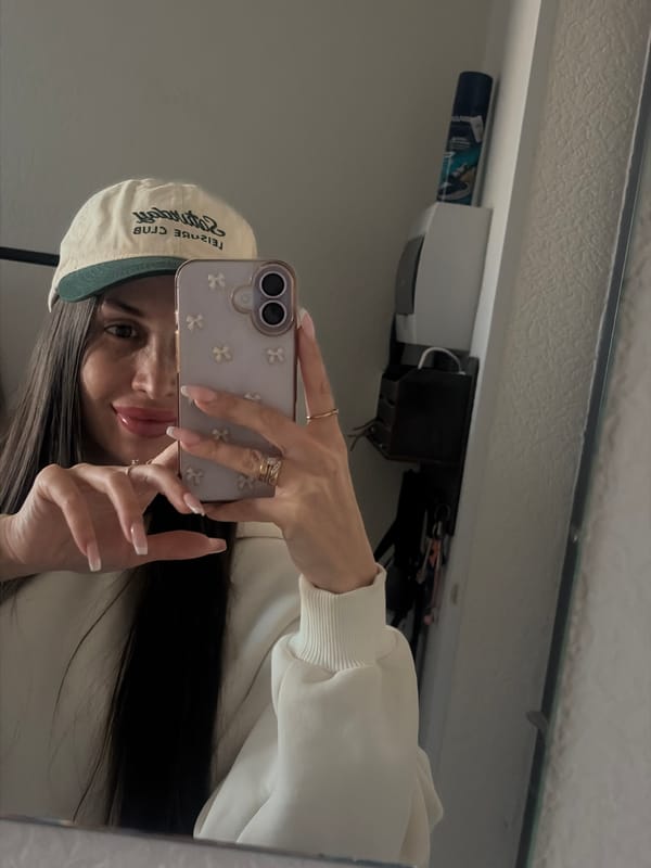Woman Takes Multiple Mirror Selfies in Saint Petersburg