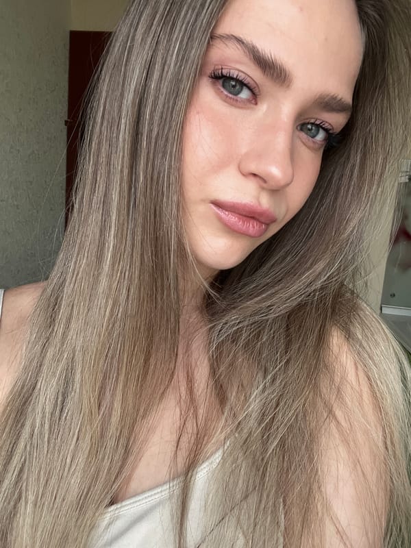 Woman takes multiple indoor selfies in quick succession