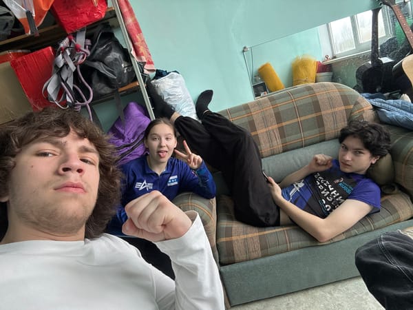 Three people photographed lying upside down on couch in Berezniki