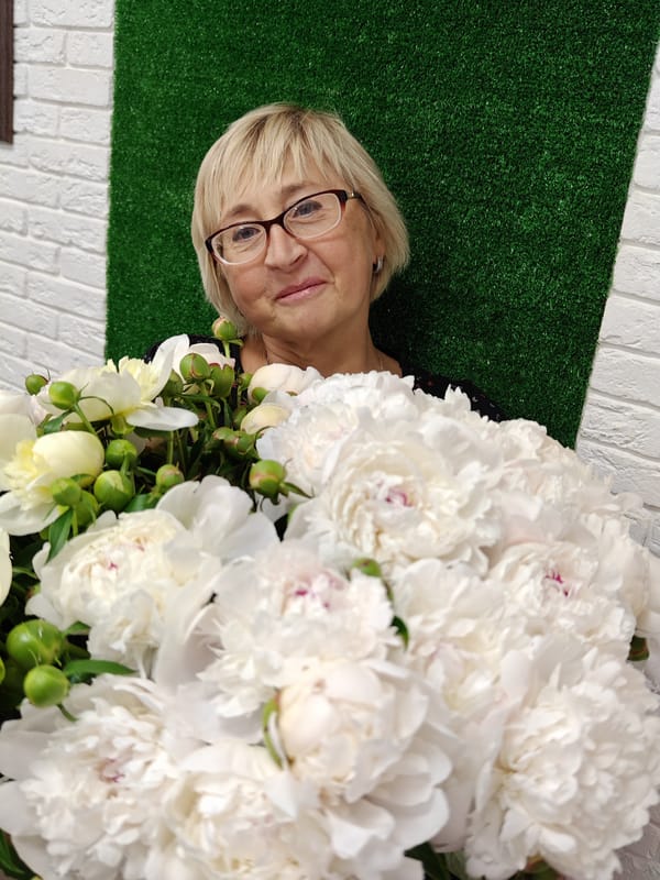Woman photographed with white peonies bouquet in Ufa