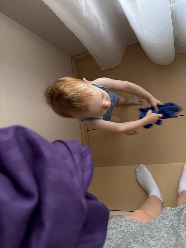 Child plays at home in Russian village