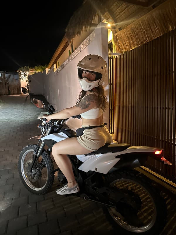 Motorcyclist spotted on dirt bike during nighttime street scene