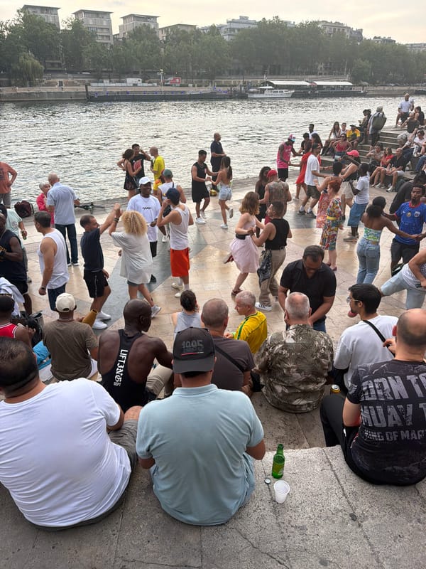 Dancing and socializing along the Seine on a summer evening
