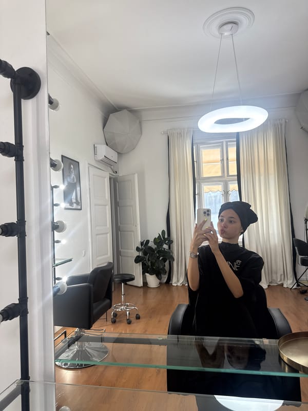 Woman takes selfies during hair salon visit