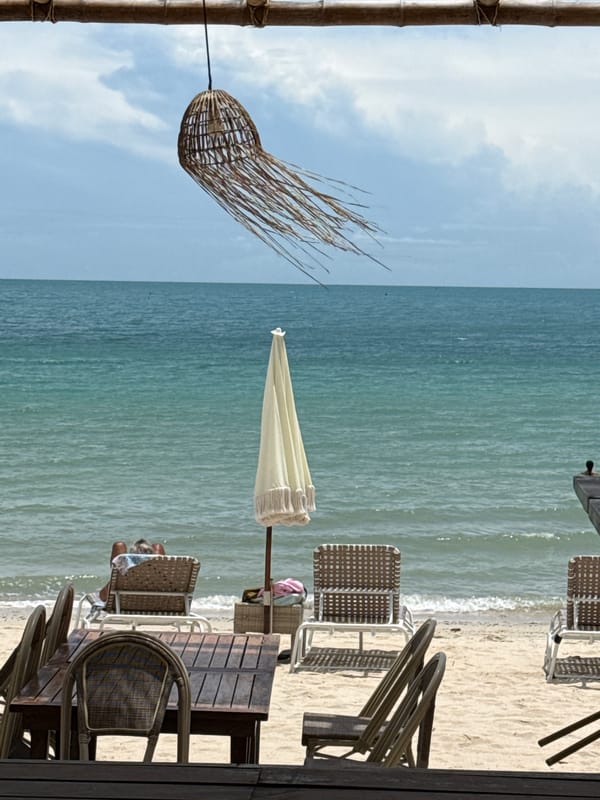 Early morning beach relaxation captured in Baan Tai, Thailand