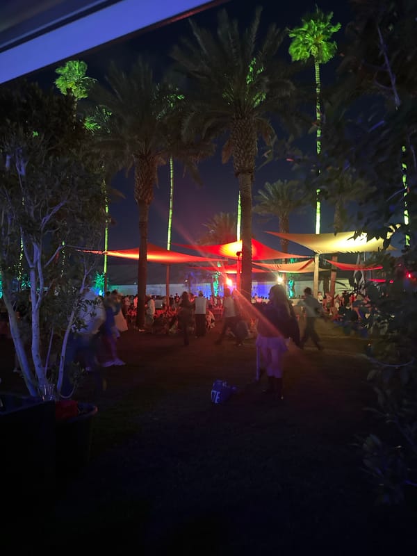 Large crowd gathers at outdoor field event