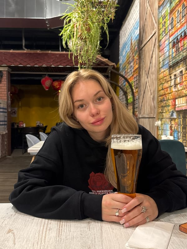 Woman dining at Moscow cafe captured in evening photos