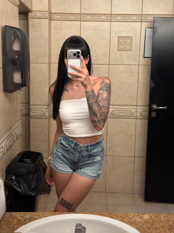 Woman takes mirror selfies in Plovdiv restroom