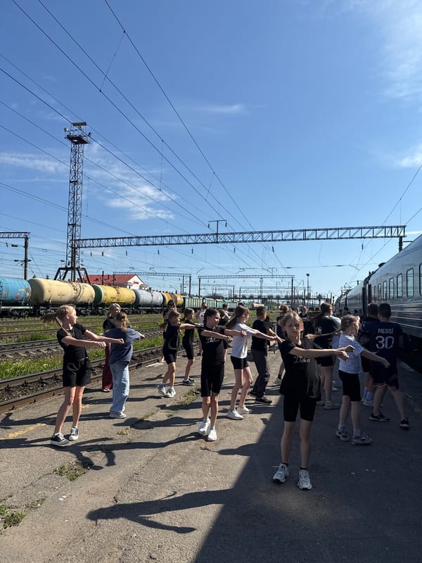 Young group performs synchronized movements on Kanash railway platform