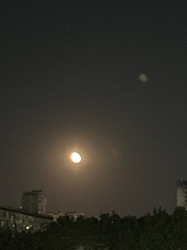 Unusual green glow observed alongside moon in Burgas night sky
