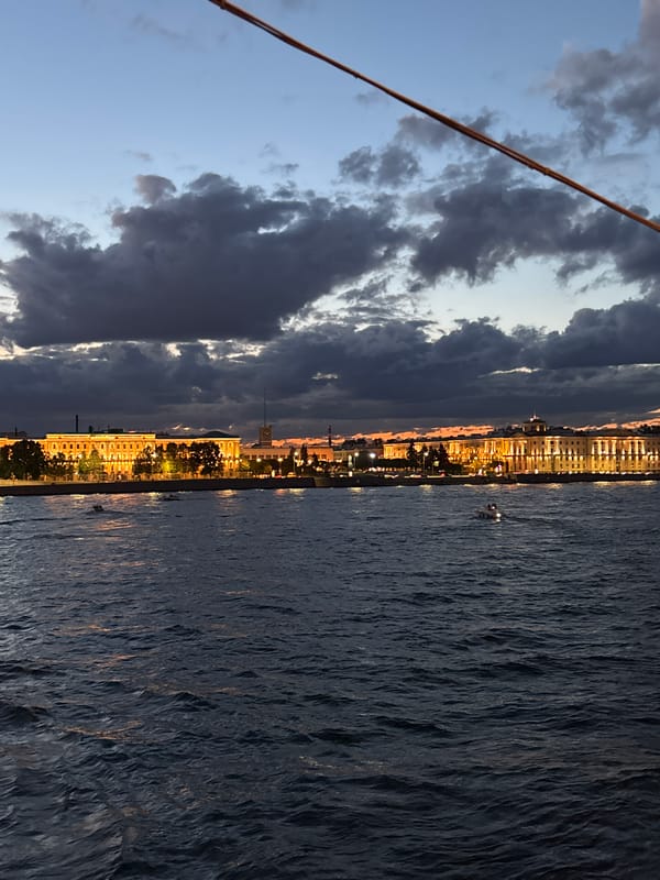 Saint Petersburg's drawbridges rise over the Neva at dusk