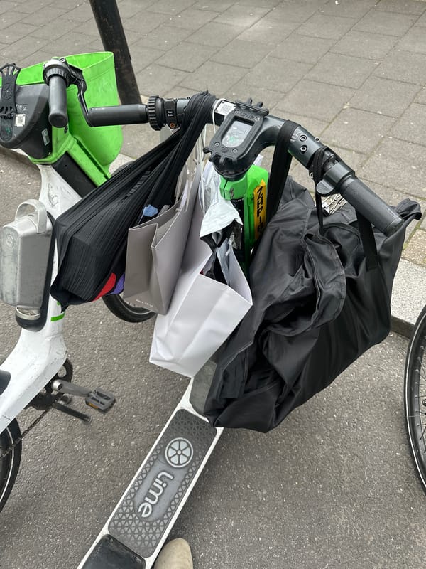 Shopping-laden Lime bike parked on London street