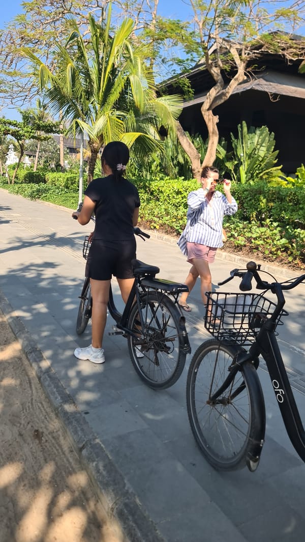 Active beach promenade scene in Denpasar, Bali
