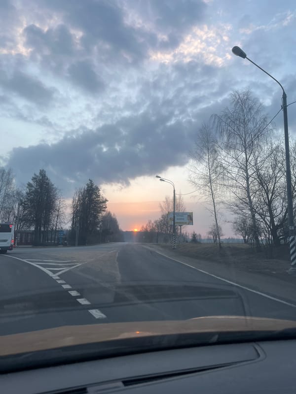 Sunset viewed from vehicle on Russian road