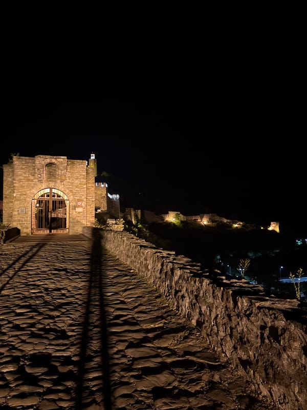 Tsarevets Fortress glowing at night over Veliko Tarnovo
