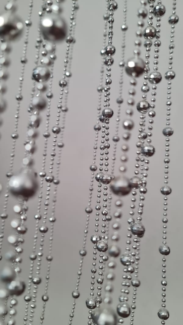 Close-up study of silver beaded strands in Klaipėda