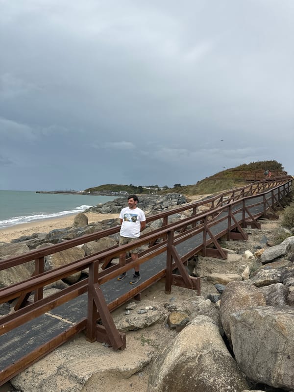 Overcast afternoon on Courtown's boardwalk and rocky shore