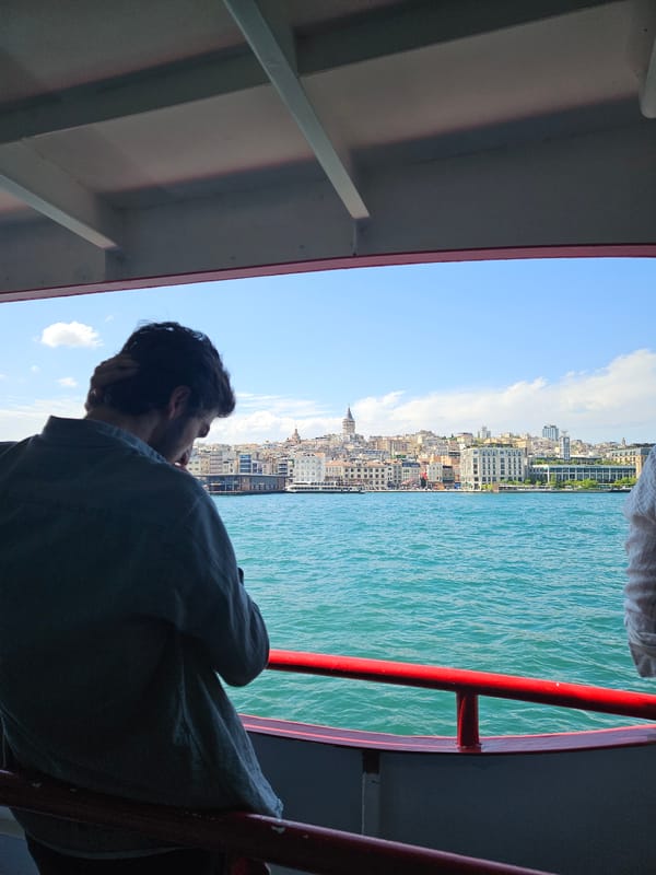 Ferry passenger documents Istanbul harbor with cruise ships, Galata Tower