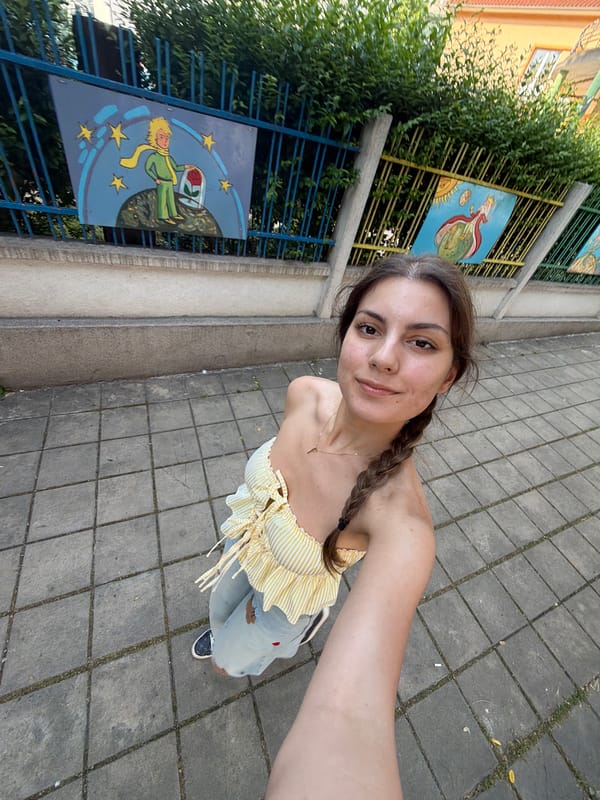 Woman takes selfies on street in Burgas, Bulgaria
