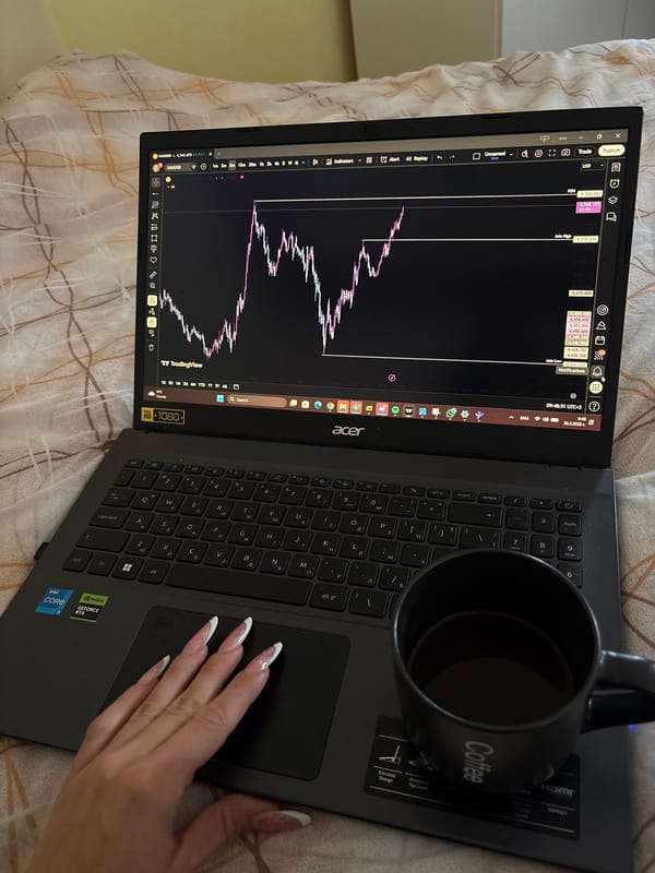 Remote trader works from bed with laptop and coffee